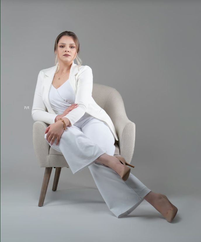 Thais Silva in a white suit